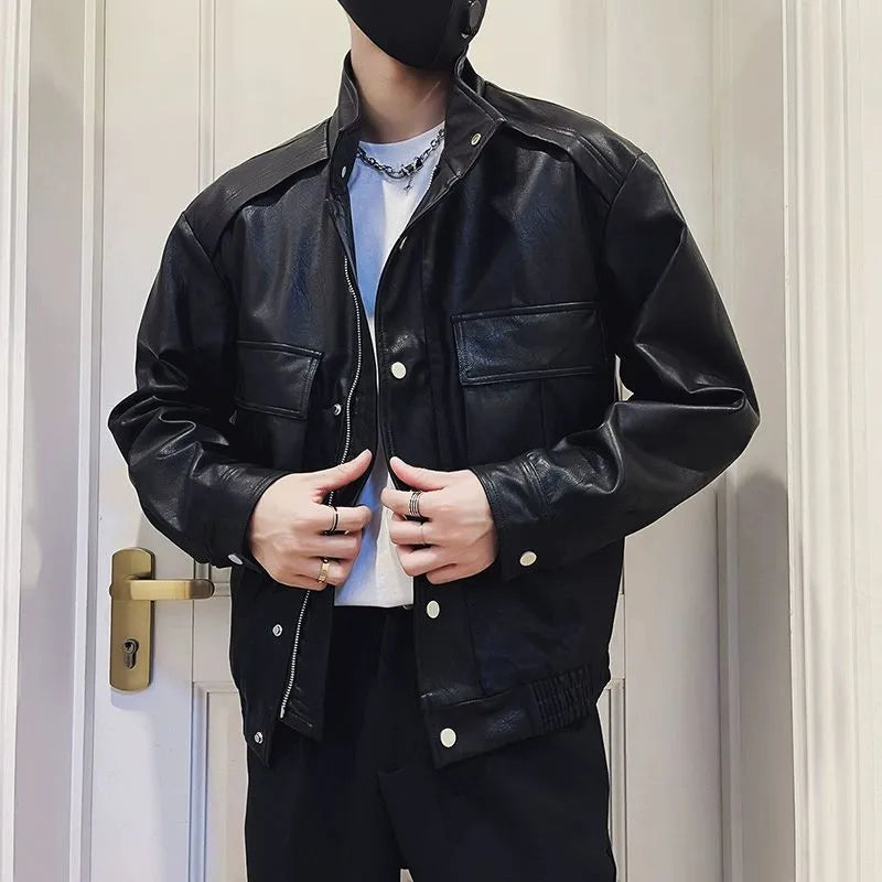 Men's black PU leather pilot jacket with side pockets and a straight hem, shown on a model.