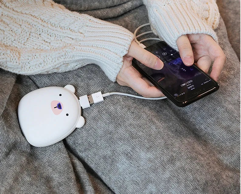 Cartoon penguin polar bear USB rechargeable hand warmer power bank showing black, white, and white-black colour options