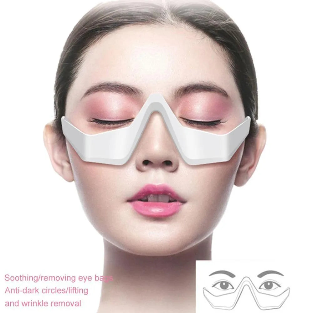 Pink and white micro-current eye massager with glasses-style design on a stand.