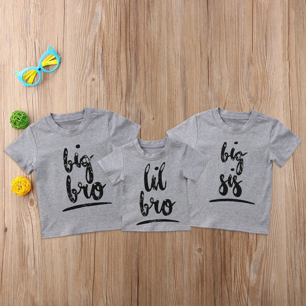 Grey printed cotton t-shirt shown in sizes for children and adults.