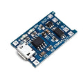 Small blue lithium battery charging and protection circuit board with solder pads, measuring 2.6 by 1.7 centimetres.