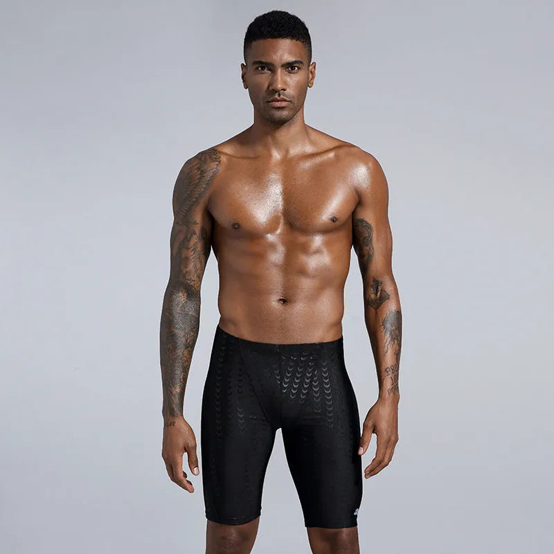 Men's solid colour swimming trunks in waterproof shark skin polyester fabric
