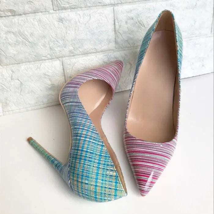 Women's pink to blue gradient patent leather pointed-toe high heels with a high stiletto heel on a rubber sole.