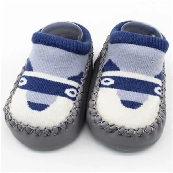 Pair of pastel coloured baby socks with anti-slip dots on the sole, shown flat.