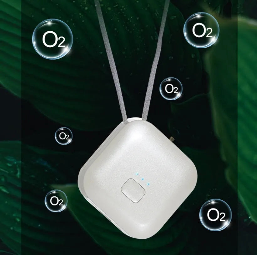 Compact USB-powered air purifier necklace in pink, showing wearable design and one-button control.