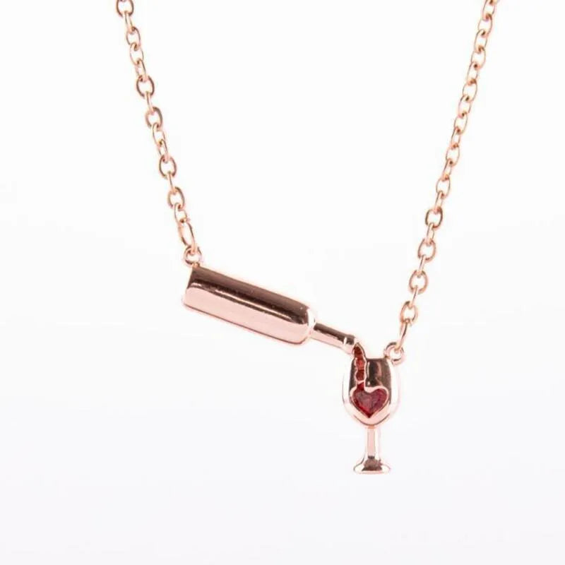 Wine bottle and cup pendant necklace with red enamel heart on gold chain