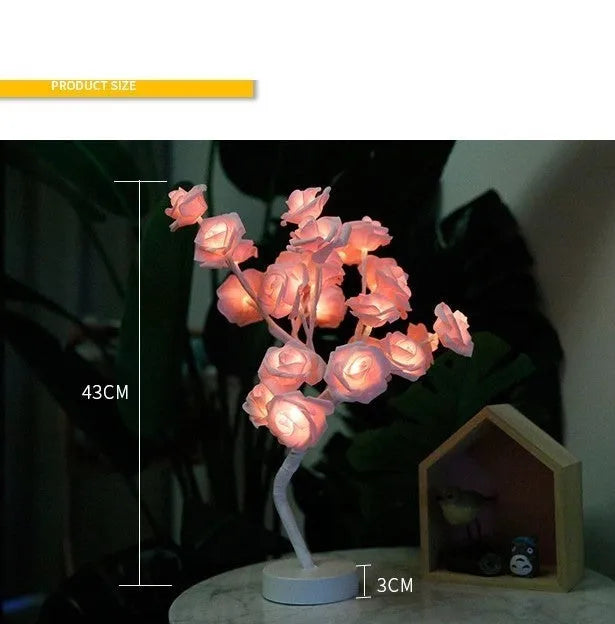White and red rose flower shaped USB battery LED table lamp with warm white light on a table