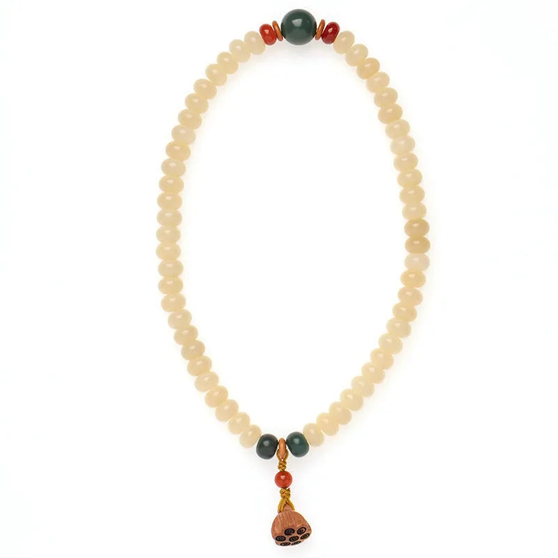 Women's cream topaz Bodhi wooden bracelet with flat round beads on a 15-20cm wrist.