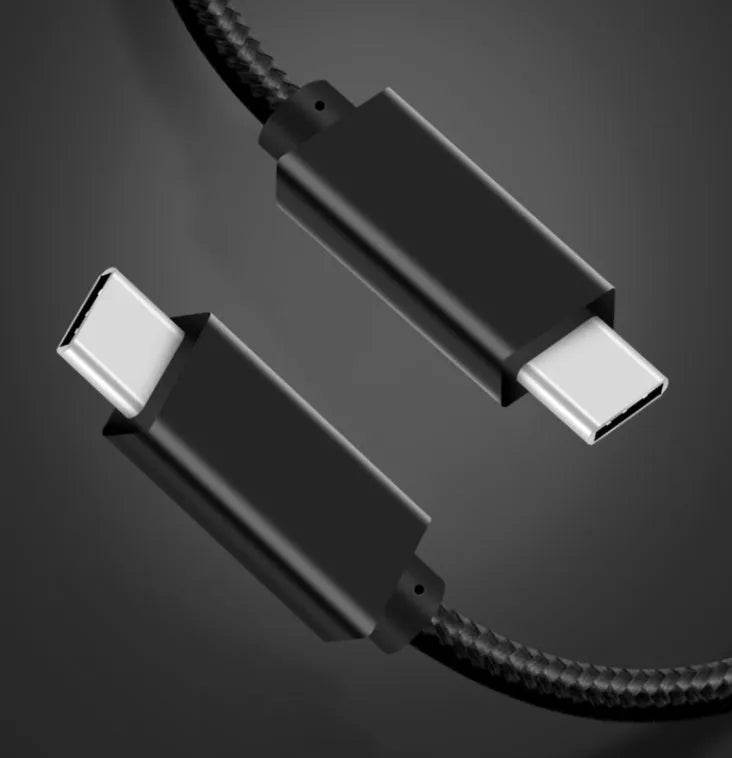 Black USB-C to USB-C cable with stainless steel plug, shown coiled, for 100W charging and 4K video.