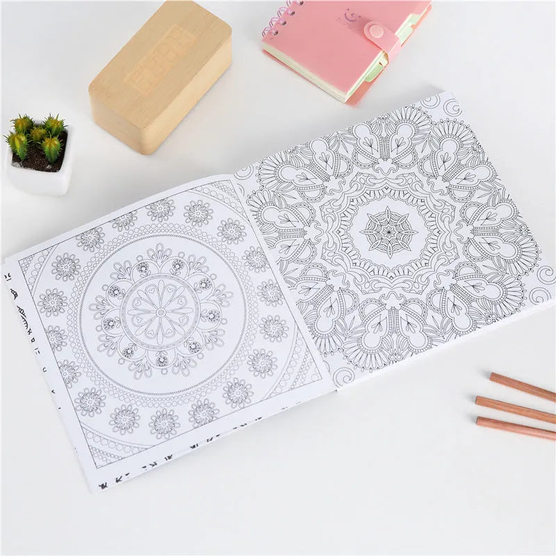 Square 21cm mandala colouring book with soft cover binder binding, shown open to a detailed pattern.
