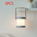 Foldable touch dimmable LED night light in white, showing both table lamp and expanded lantern modes.
