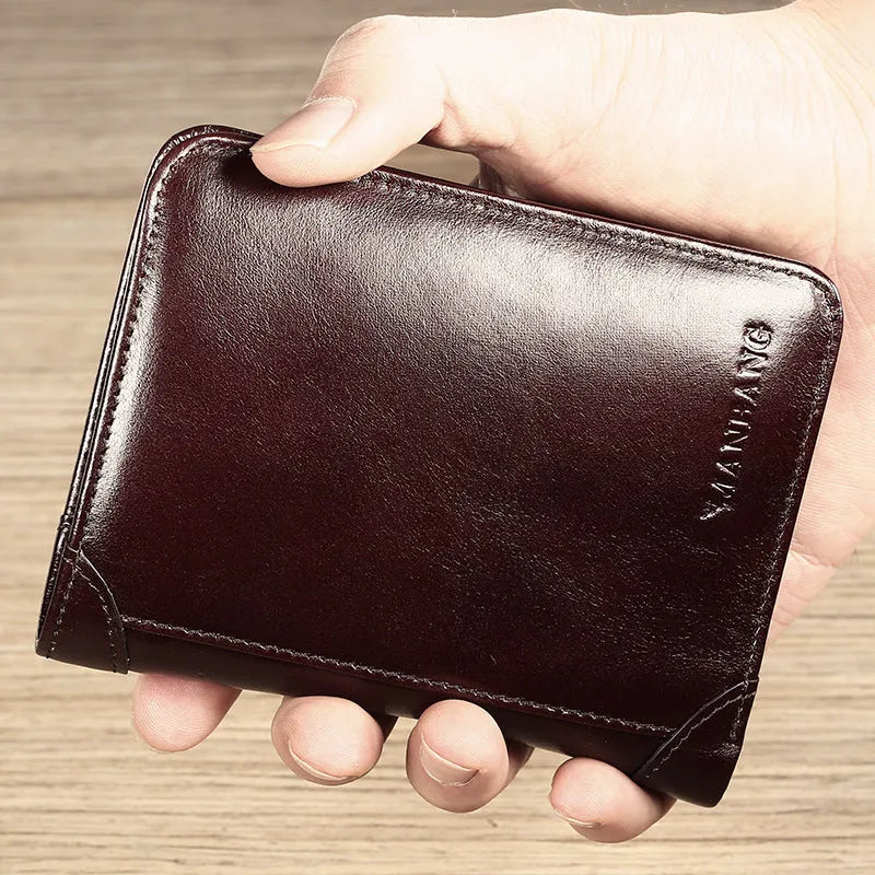 Men's black full-grain leather bifold wallet open, showing eight card slots and a zipped coin pocket.
