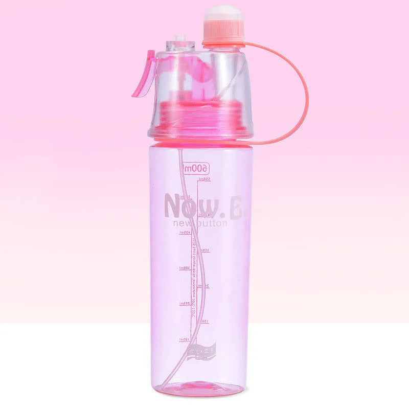 Green portable sports mist spray cup with transparent body, scale markings, and a black spray mouth cap.