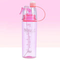 Green portable sports mist spray cup with transparent body, scale markings, and a black spray mouth cap.