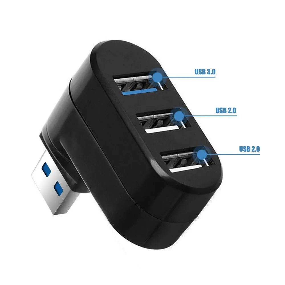 Black USB 3.0 four-port rotary hub on a desk next to a laptop, showing compact size.