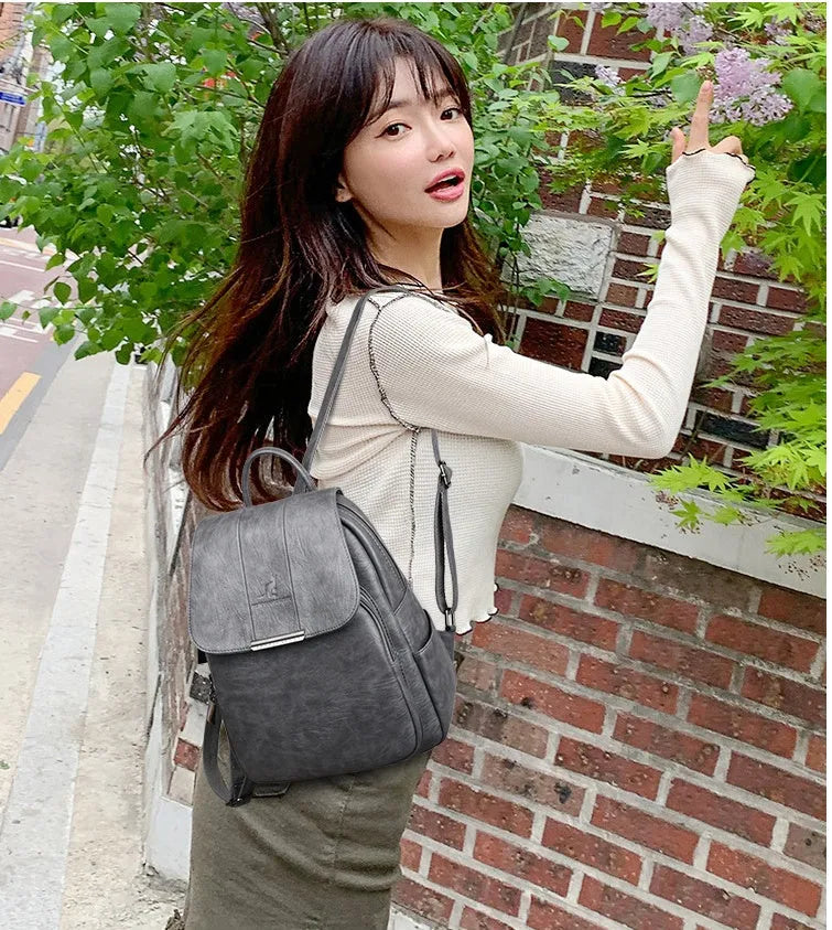 Fashion backpack in PU material with dimensions 30x24x12cm, shown in five colours including Black and Grey