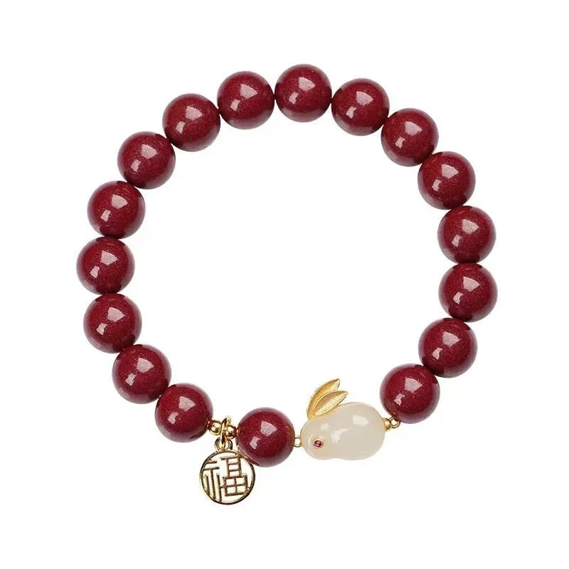 Cinnabar bracelet with jade hare charm and purple gold sand beads in retro style
