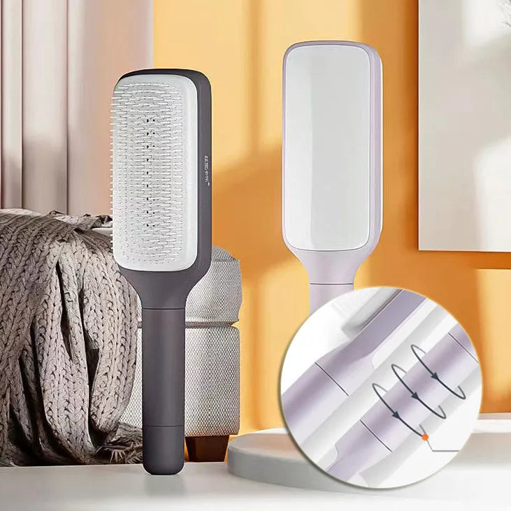 Roland purple self-cleaning hair brush with anti-static teeth and rotating telescopic handle on a white background.