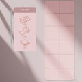 Folded purple TPE gymnastic mat showing its six-fold design on a wooden floor.