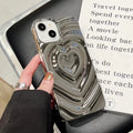 Solid colour iPhone case with a three-dimensional raised heart design on a glass back with TPU bumper.