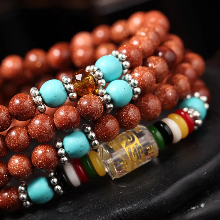Women's golden star stone mantra bracelet with 108 nugget sand pieces and Chinese fu character ornament