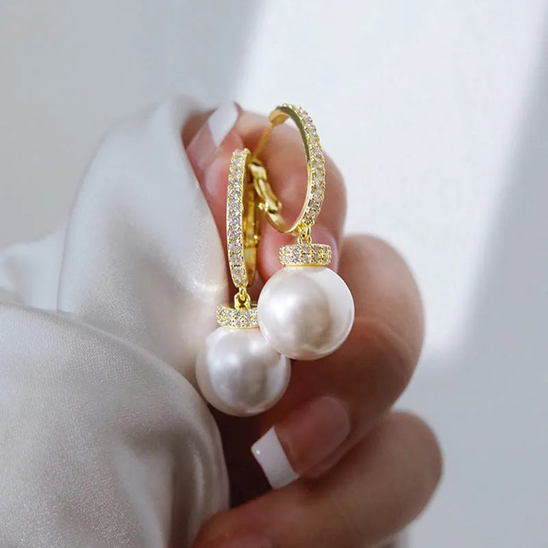 Yellow gold copper earrings with imitation pearl and inlaid zircon in geometric round shape
