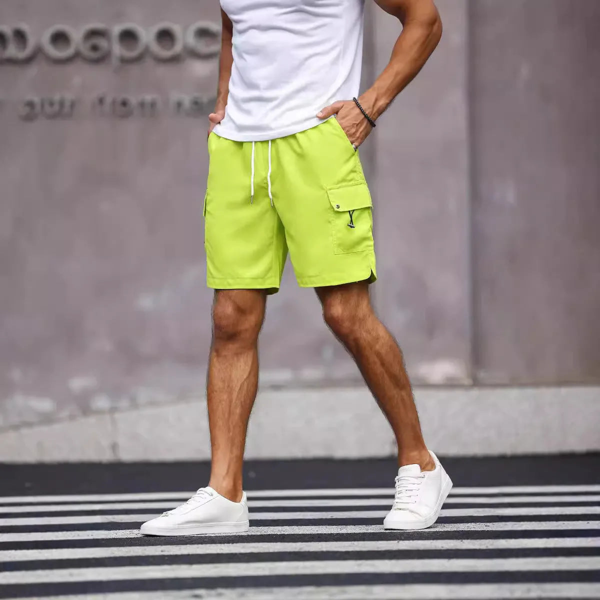 Men's loose fit workwear shorts in fluorescent green and army green colours with straight cut and fifth pants length