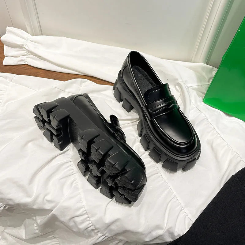 British style wide fit patent leather loafers with a rubber sole and muffin heel base.