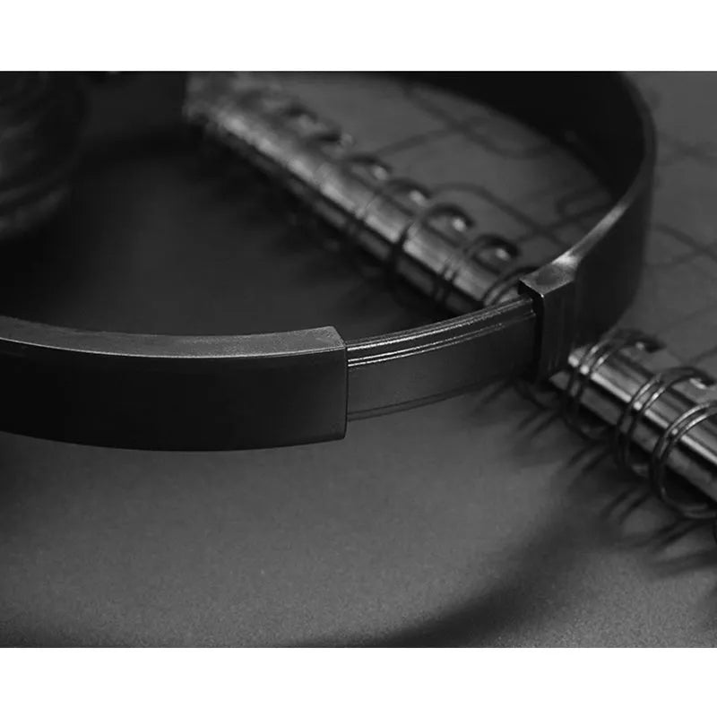 Black folding over-ear wired headphones with adjustable headband and 3.5mm plug