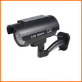 Black solar simulation gun camera security deterrent with flashing red LED light for property protection