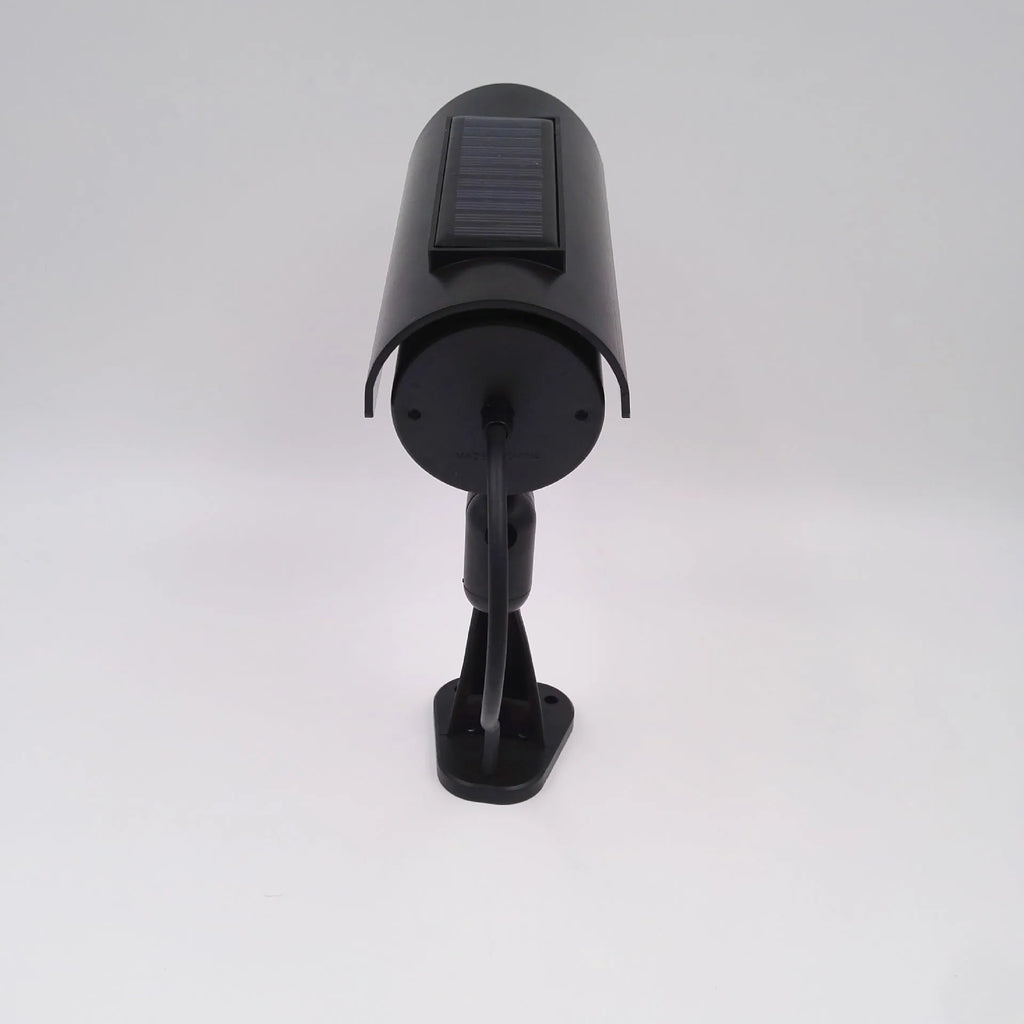 Black solar simulation gun camera security deterrent with flashing red LED light for property protection