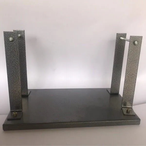 Black iron flip chip bracket for mounting an electric planer upside down, showing dust port.