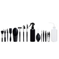 Black plastic and metal mini garden tool set for succulents, including small shovel, tweezers, brushes, bottle, and a square cushion.
