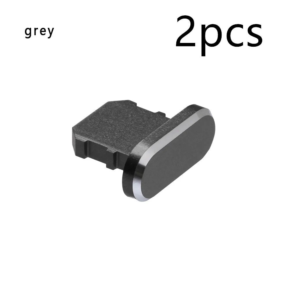 Aluminium alloy charging port dust plug for iPhone in various metallic colours including gold and rose gold.