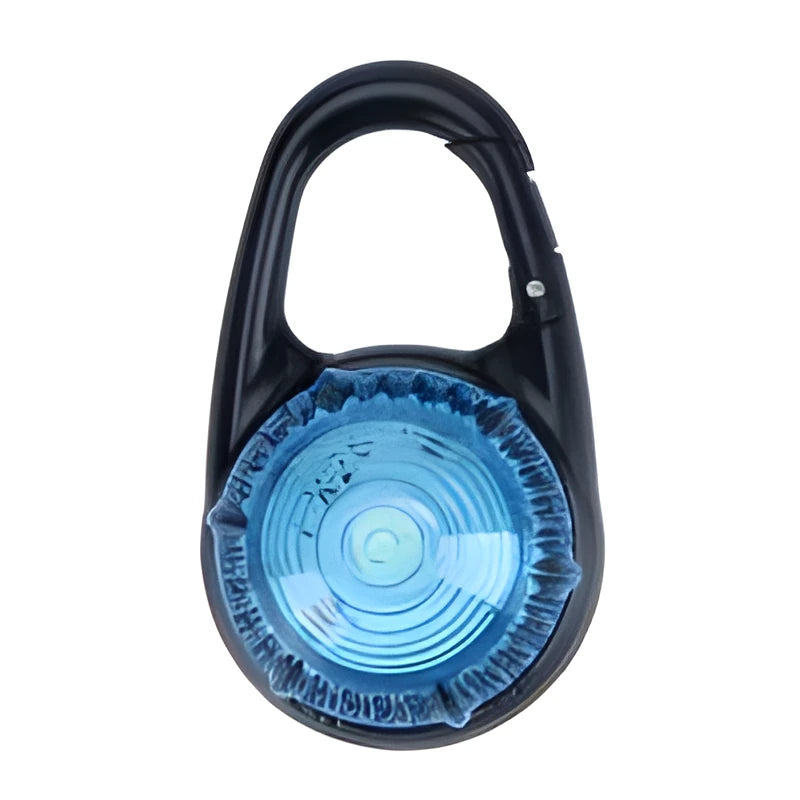 Pink LED flashing pet safety pendant clipped onto a collar with CR2032 batteries, showing 57x33mm ABS water-resistant build