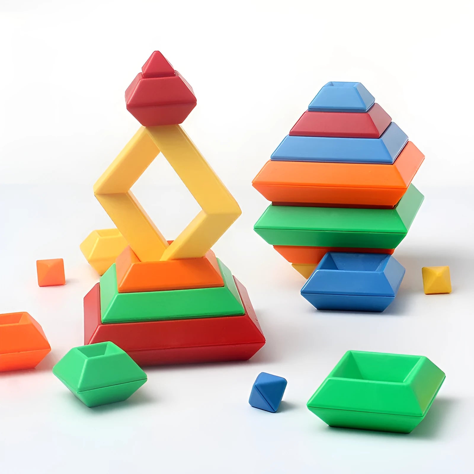 Rainbow coloured tower ring building blocks set for children, with plastic ABS pieces in a barrel.