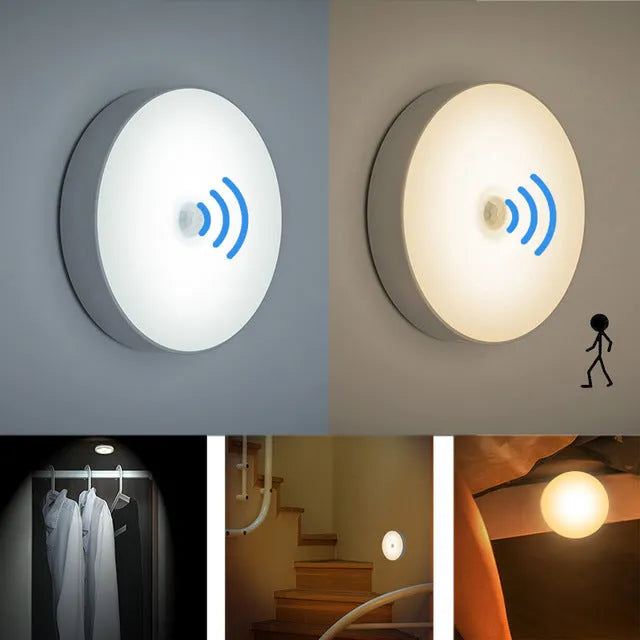 Small circular white USB-rechargeable motion sensing LED night light with adhesive backing.