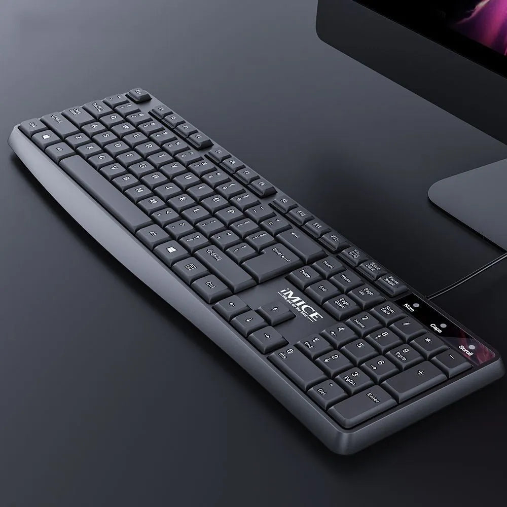 Black KM-520 wired keyboard and mouse set showing 104-key keyboard and optical mouse with USB cables