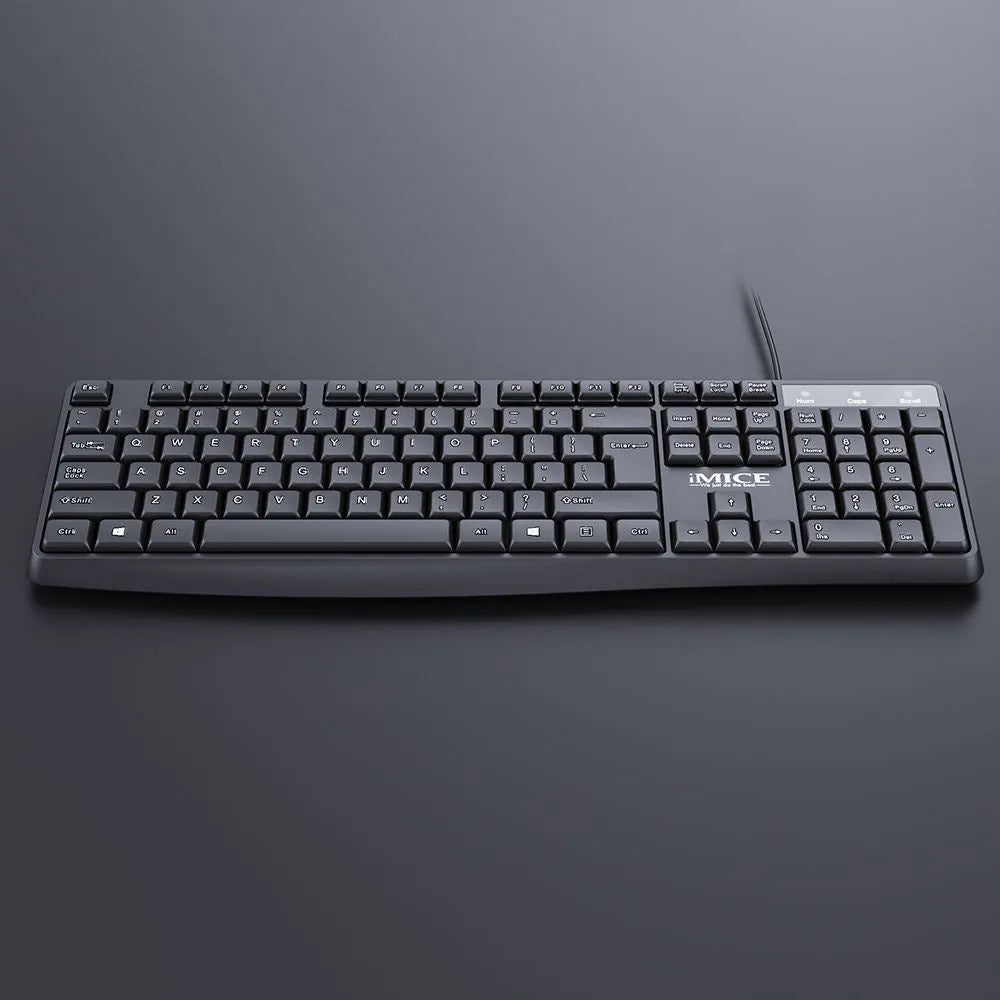Black KM-520 wired keyboard and mouse set showing 104-key keyboard and optical mouse with USB cables