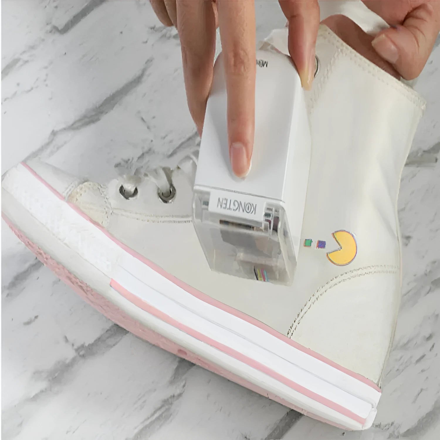 Portable Mbrush color handheld printer in white with ink cartridges showing compact size