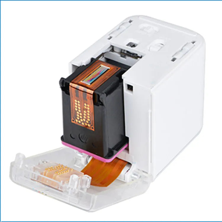 Portable Mbrush color handheld printer in white with ink cartridges showing compact size