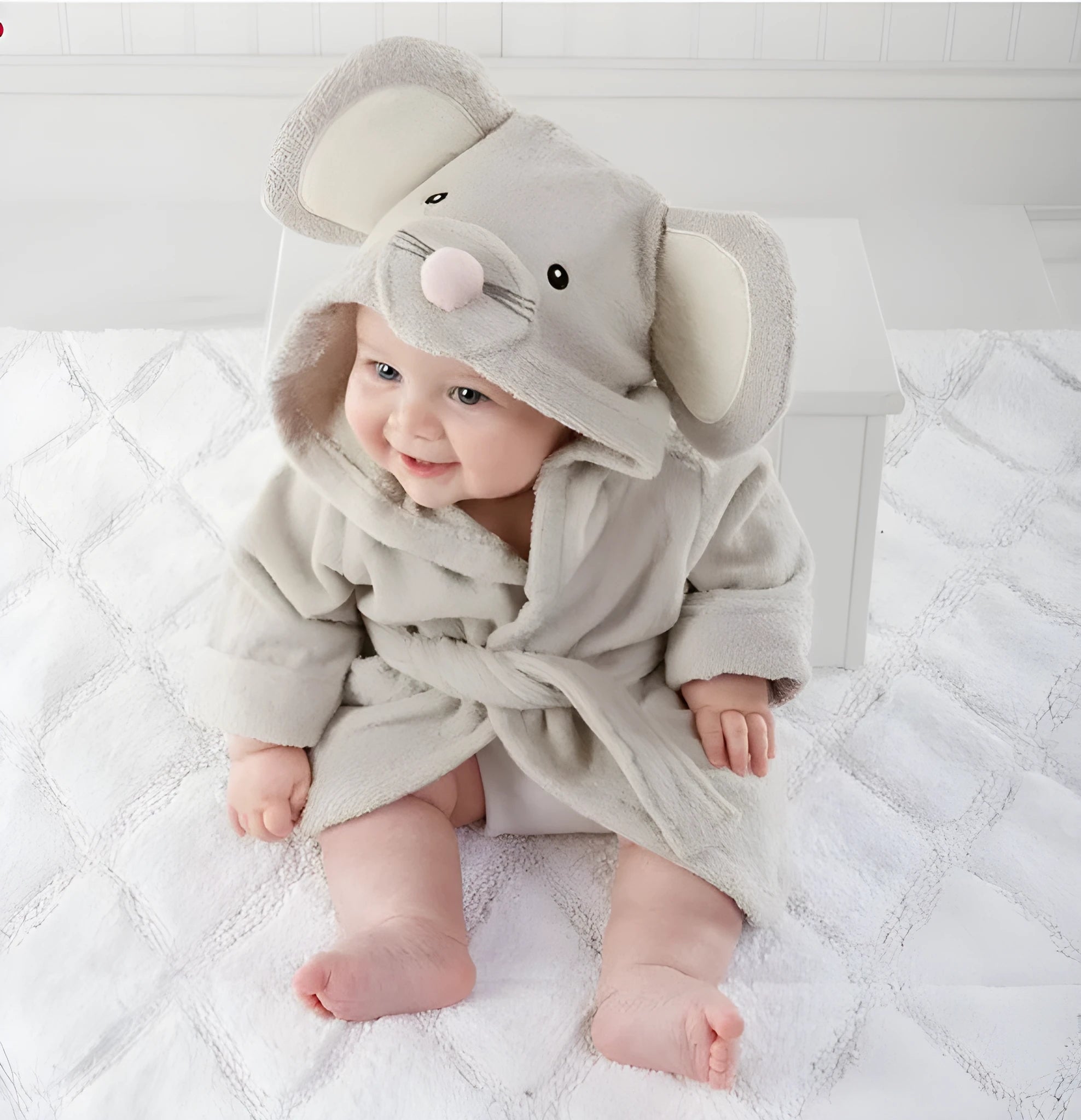 Children's hooded cotton animal-shaped bathrobe in pink with hood and front pocket, soft treatment finish.