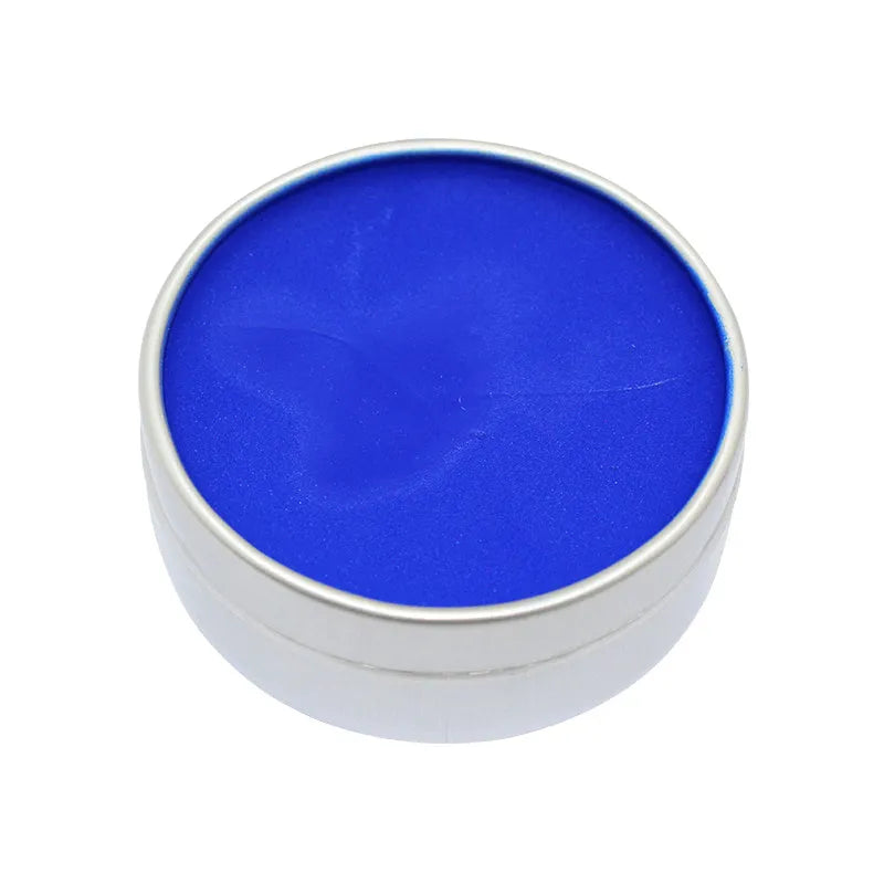 Halloween face paint palette showing twelve colours including black, white, red, gold, green, and blue