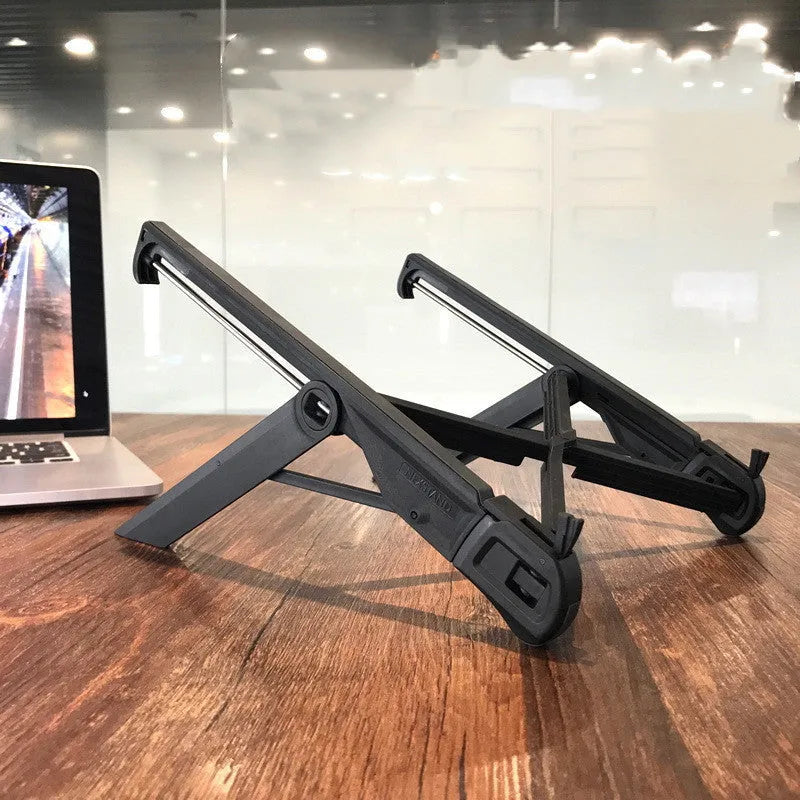 Folding notebook stand in reinforced nylon, black, with laptop raised for airflow