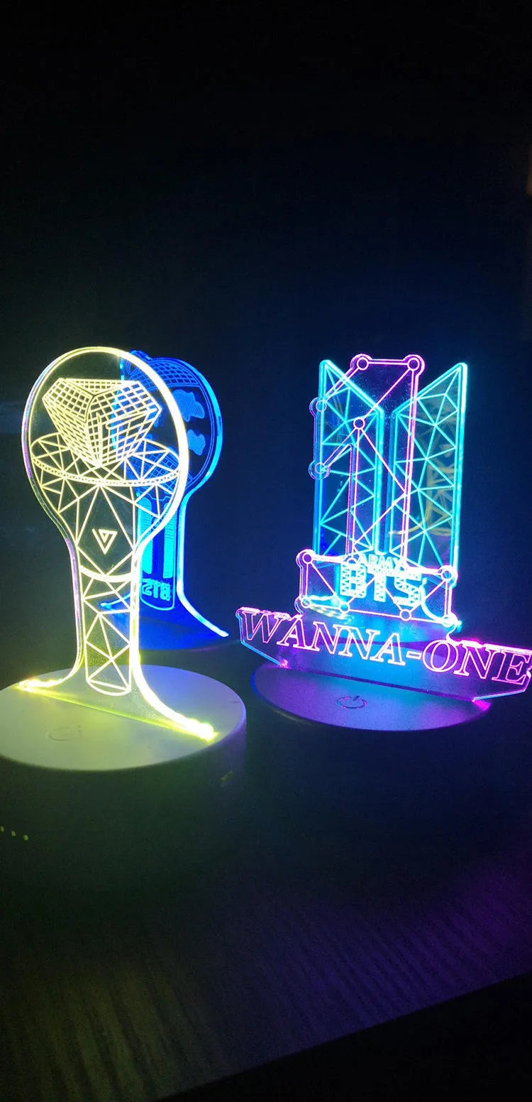 Clear acrylic stand for BTS Light 101 BTS Tower Gem album display on a table.