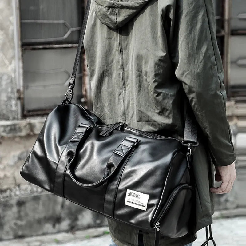 Black large capacity waterproof PU leather sports training bag with multiple zipper pockets and a single strap.