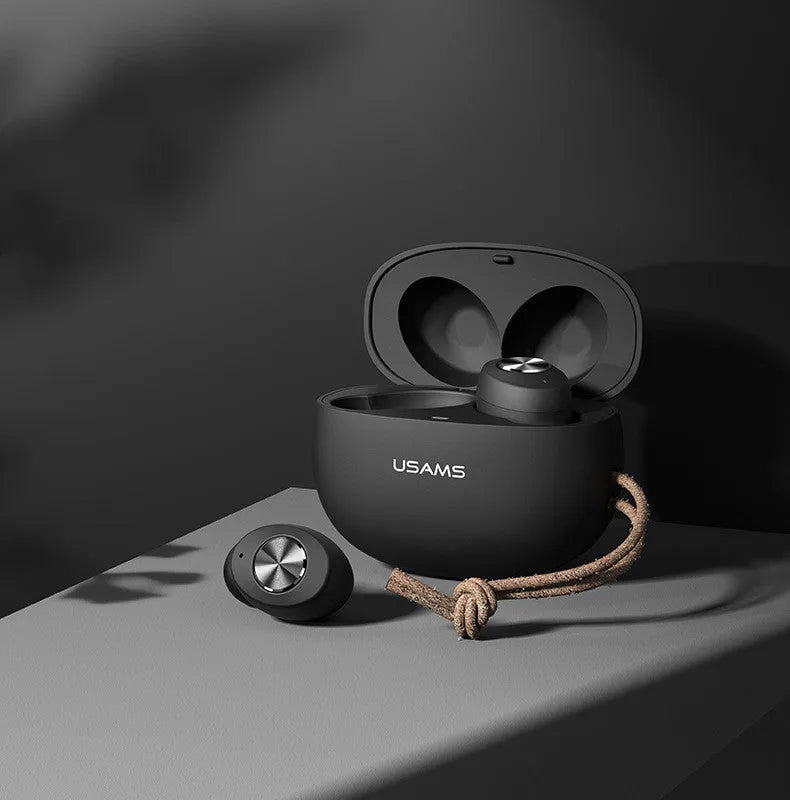 Pebble Series wireless Bluetooth earbuds in charging case, shown in black, white, or dark green.