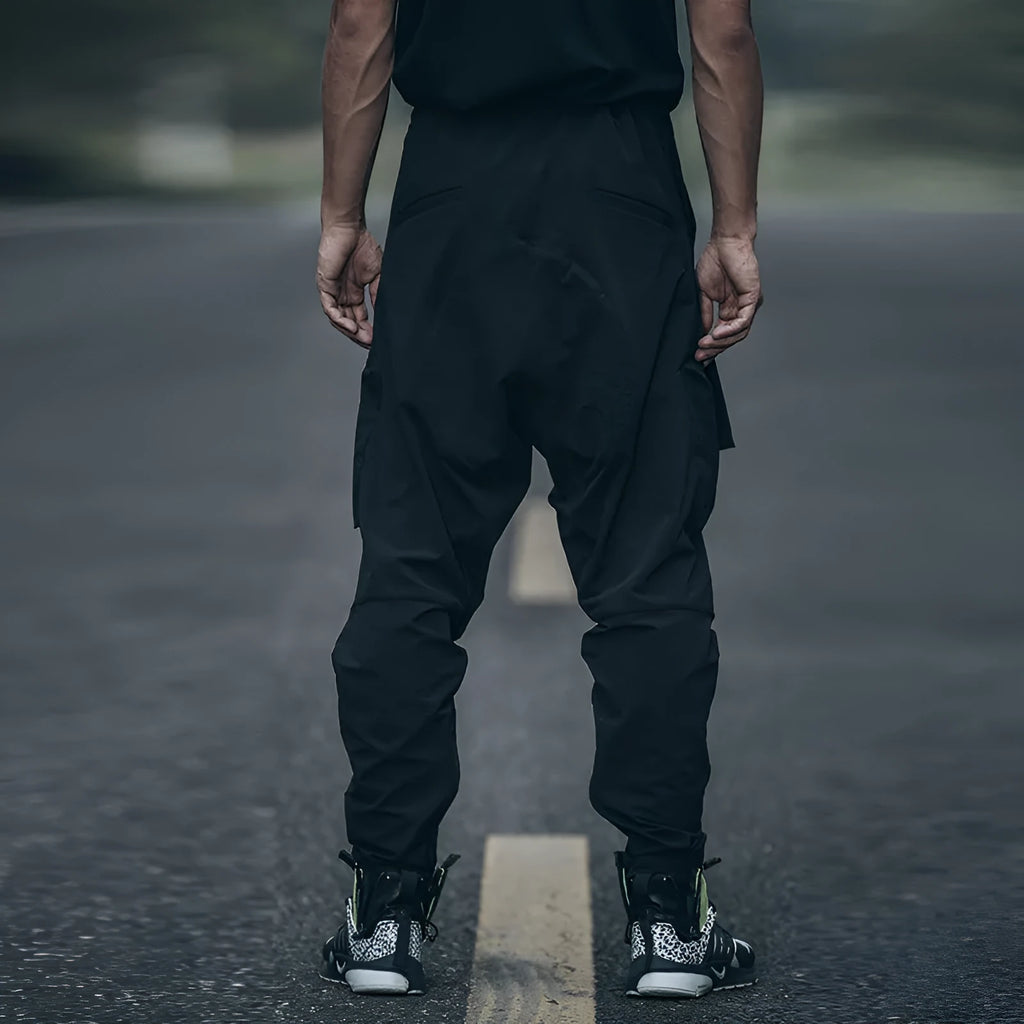 New men's black casual pants with loose fit and pockets on a model
