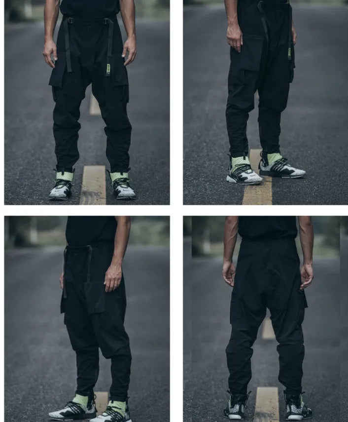 New men's black casual pants with loose fit and pockets on a model