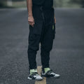 New men's black casual pants with loose fit and pockets on a model